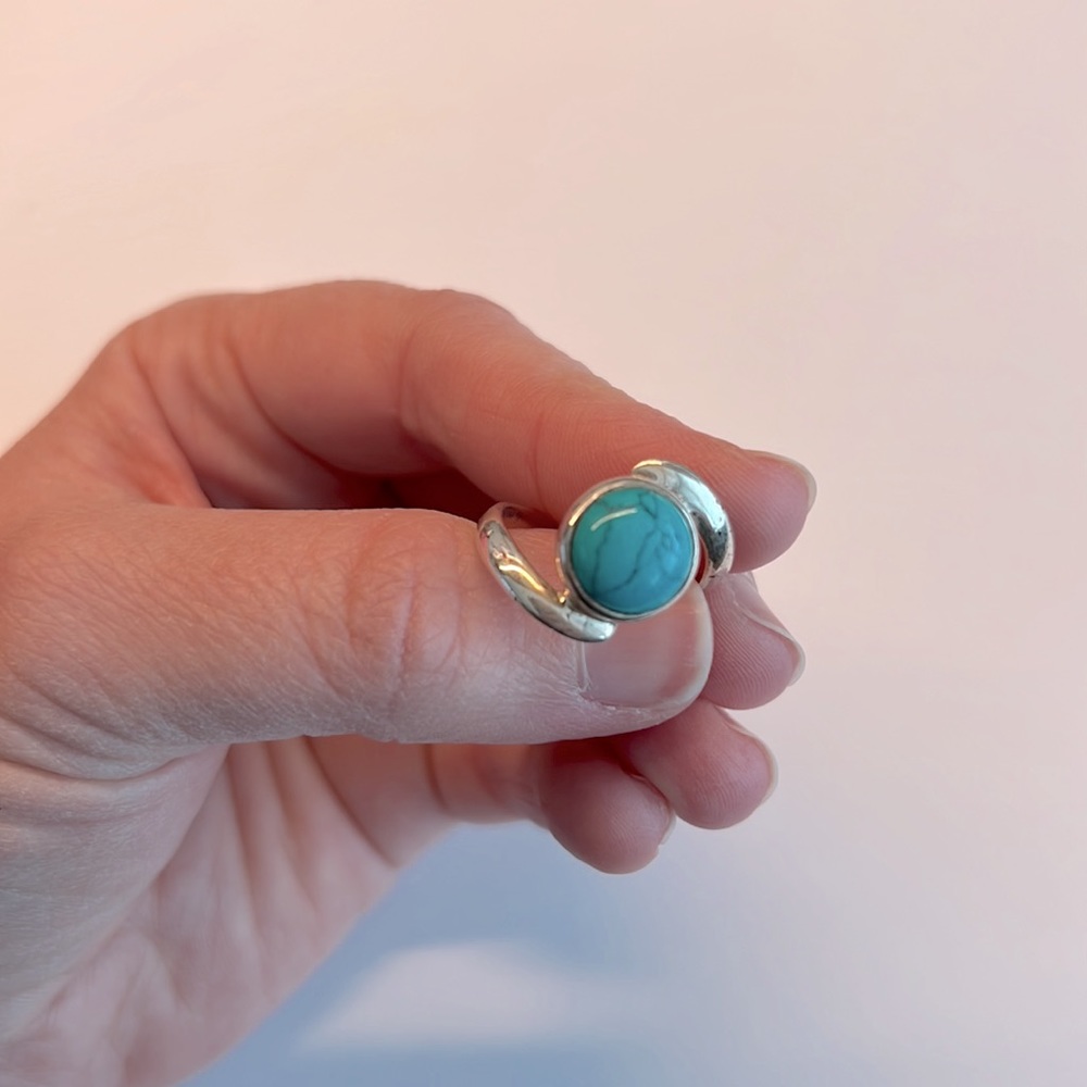 Asymmetrical round turquoise ring in silver, approximately size 7